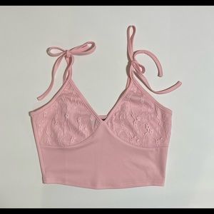 Pink crop top with tie straps and lace